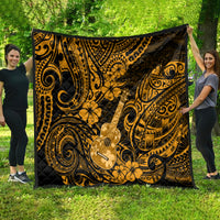 Gold and black Polynesian-style quilt with ukulele graphic and swirling patterns, spread out