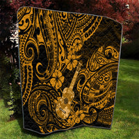 Black and gold ukulele-themed quilt featuring Polynesian scrollwork and flower motifs, spread