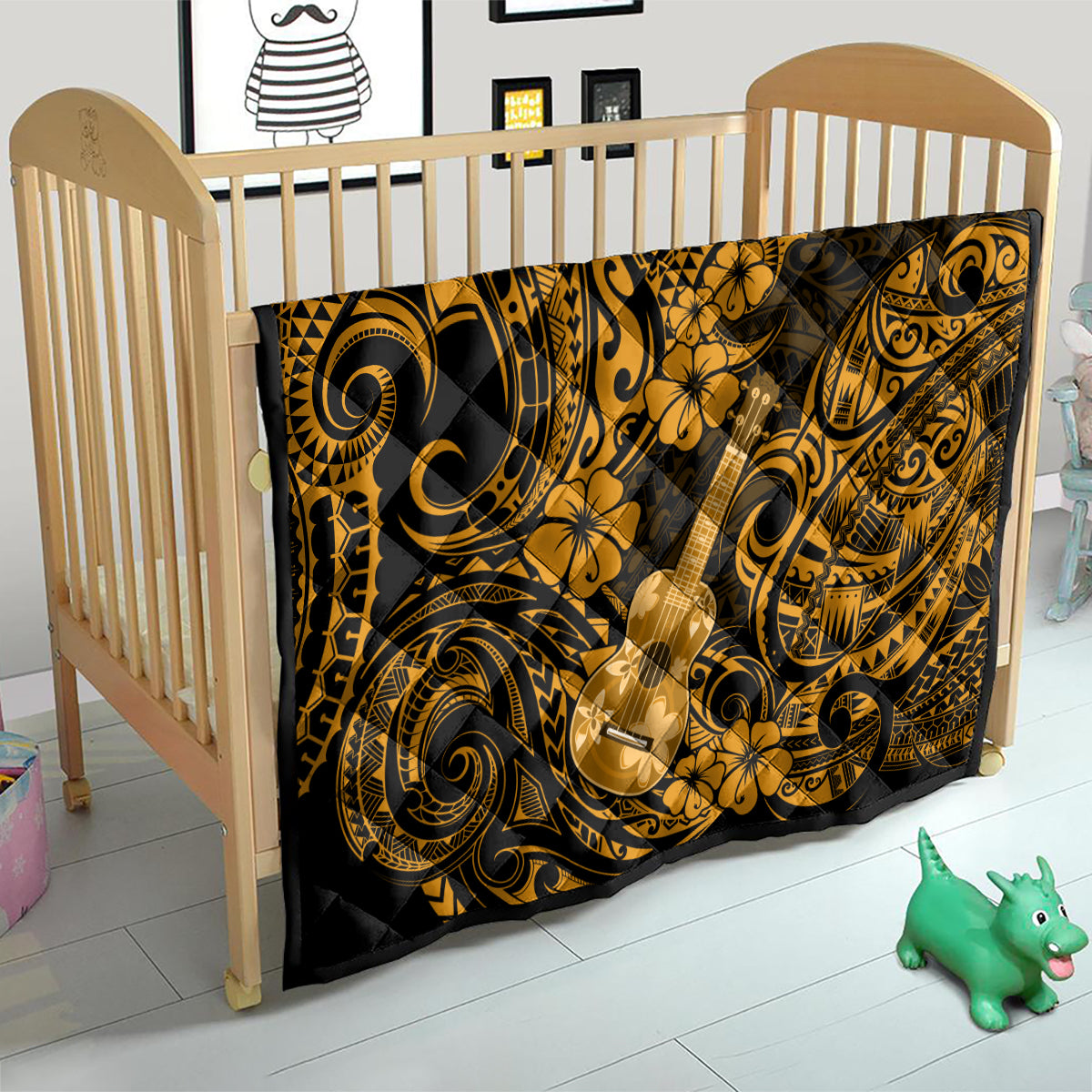 Gold and black Polynesian ukulele quilt covering a toddler bed, with swirling and floral motifs