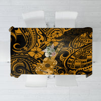 Black and gold polynesian tablecloth with guitar, floral, and tribal motifs