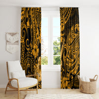 Gold Polynesian pattern curtain panels beside a window, hanging straight and full