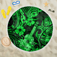 Green round beach blanket with fringed edge, Polynesian guitar and hibiscus pattern.