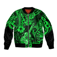 Green bomber jacket with black sleeves, full zip, and Polynesian ukulele and floral print.