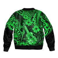 Green bomber jacket with full zip and bold Polynesian ukulele/floral pattern, black cuffs.