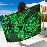 Green polynesian-pattern sarong with ukulele, swirls, and clover-like flowers