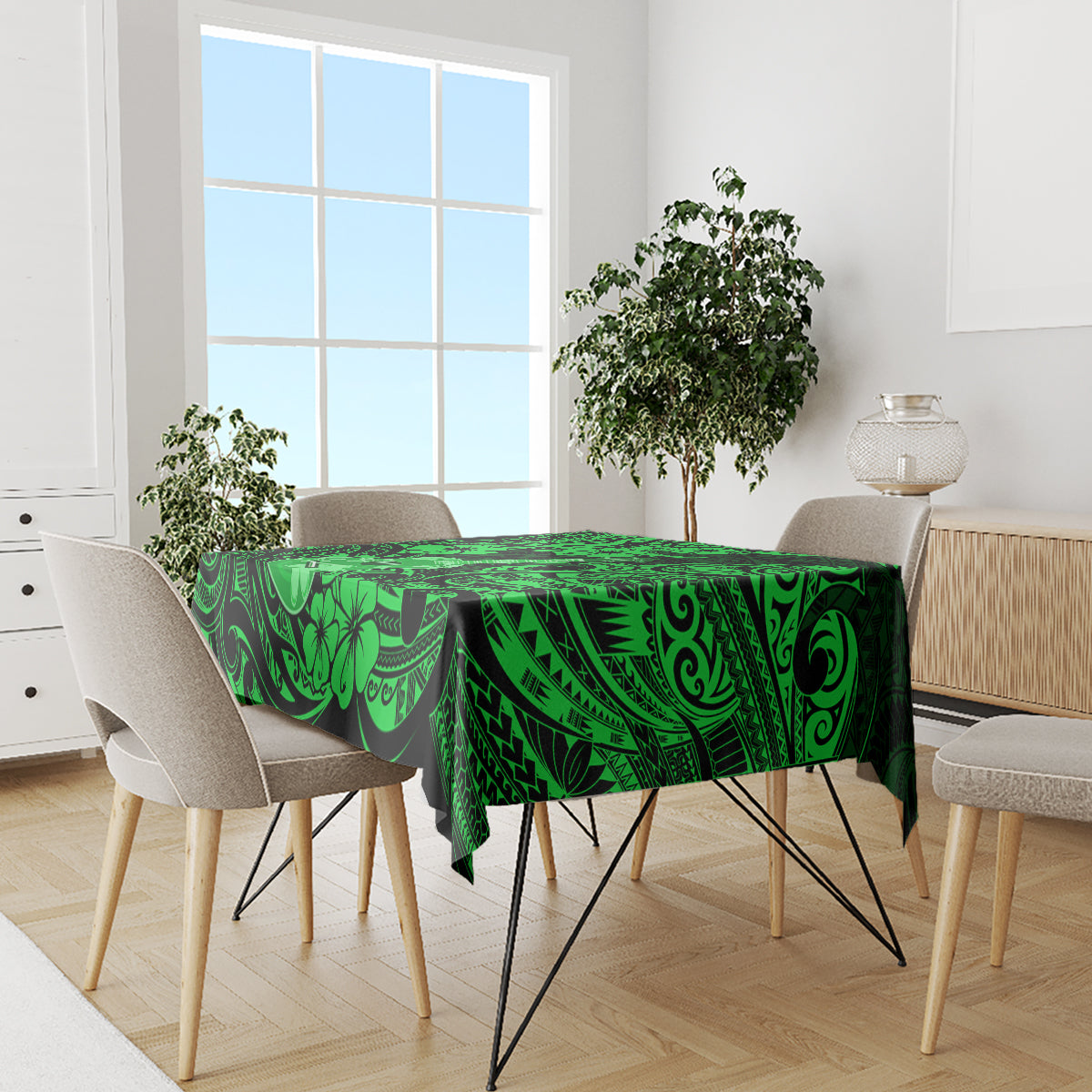 Green Polynesian-pattern tablecloth with black accents on dining table and chairs