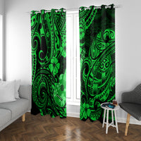 Green Polynesian pattern curtains on window rod with side table and seating