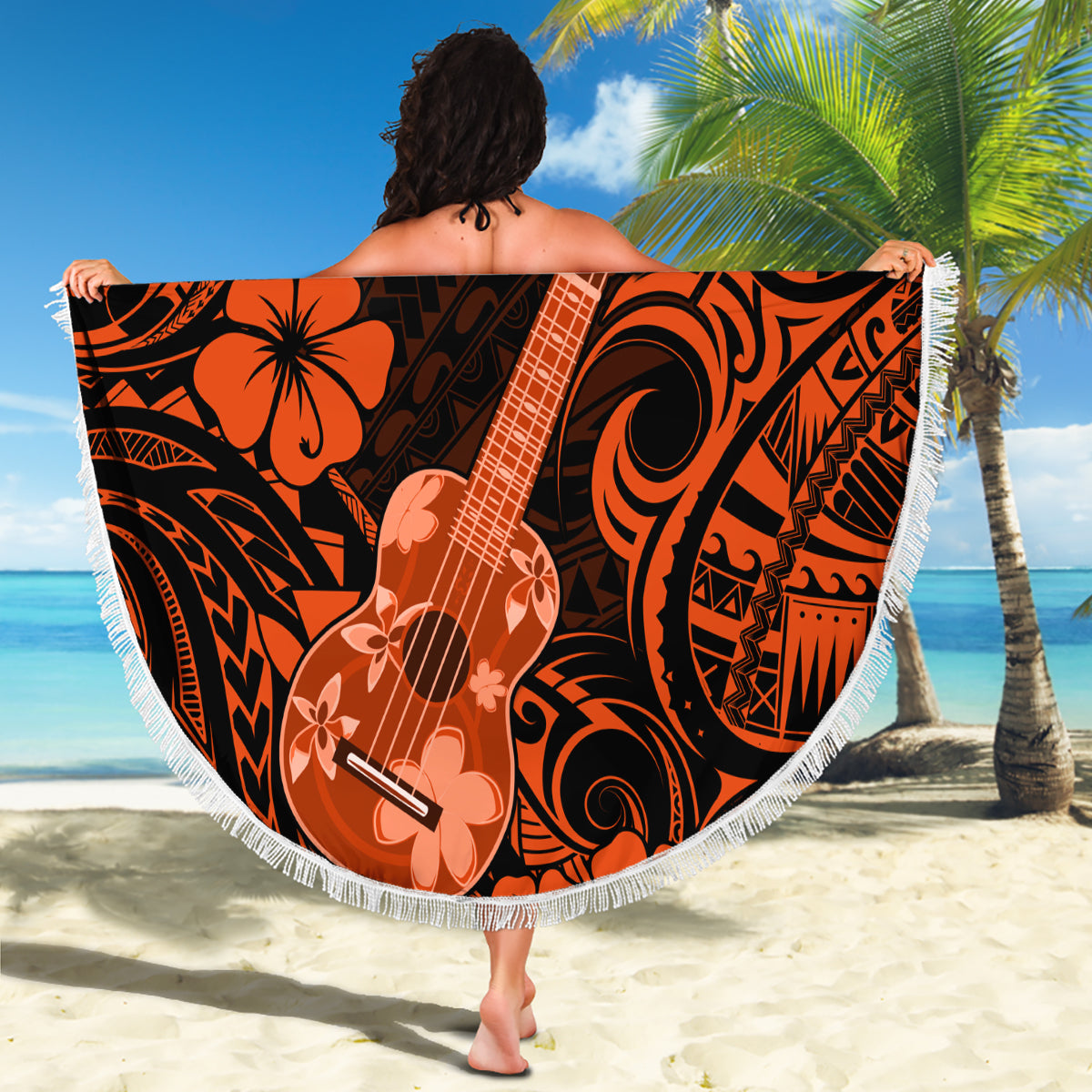 Orange and black round beach blanket with fringe edge, Polynesian guitar floral design