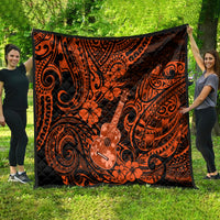 Hawaii ukulele quilt, orange-and-black Polynesian print with ukulele and floral motifs