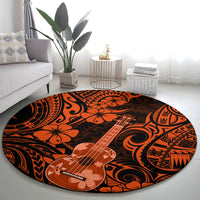 Round ukulele-themed orange and black area rug with hibiscus and swirl designs