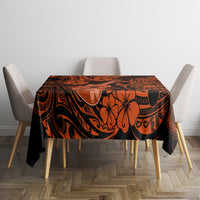 Orange and black Polynesian pattern tablecloth covering dining table, straight drop
