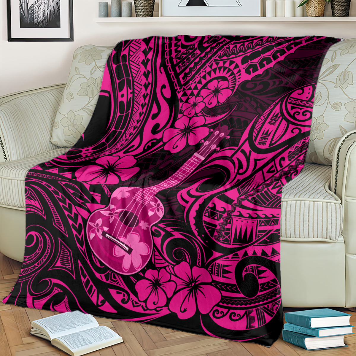 Pink polynesian ukulele blanket with hibiscus flowers and guitar motifs, draped over couch