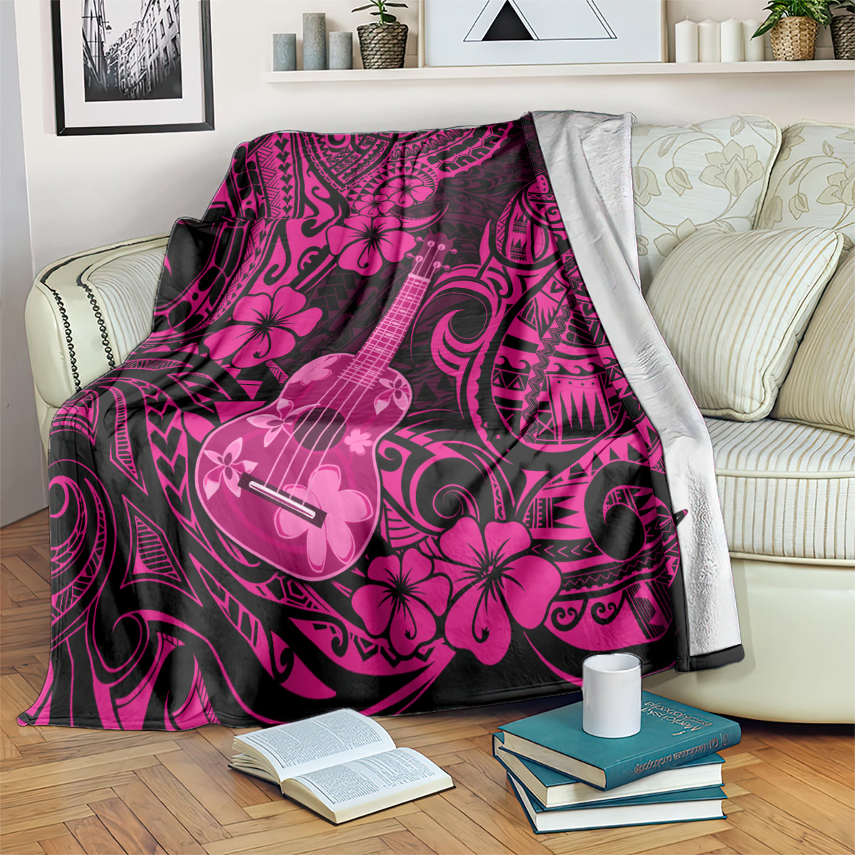 Pink polynesian ukulele blanket with hibiscus and ukulele swirls, draped and folded
