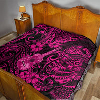 Quilt laid on bed: pink and dark Polynesian ukulele and floral swirl design.