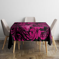 Pink and dark Polynesian-pattern tablecloth on a square table with corner overhang