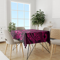 Pink and dark Polynesian hibiscus tablecloth on a dining table with chair covers