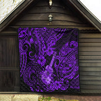 Purple Polynesian ukulele quilt hanging on wooden wall, black backing with swirls