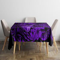 Purple Polynesian pattern tablecloth with black swirls and floral motifs on table