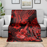 Red Hawaii ukulele blanket over gray sofa, ukulele and hibiscus polynesian pattern