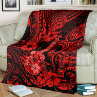 Red Hawaii ukulele blanket over cream sofa, red and black polynesian ukulele pattern