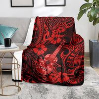 Red Hawaii ukulele blanket on couch, polynesian ukulele and hibiscus motif