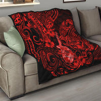 Red and black Polynesian pattern quilt folded on a sofa, ukulele and floral swirls