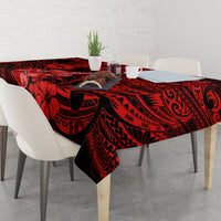 Red and black Polynesian-pattern tablecloth with ukulele motif on dining table