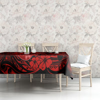 Red and black Polynesian-pattern tablecloth with ukulele motif on dining table