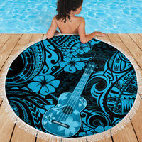 Round beach blanket on pool deck, blue polynesian ukulele print with fringed edge