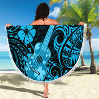 Beach blanket held up with blue polynesian ukulele design and fringed round edge