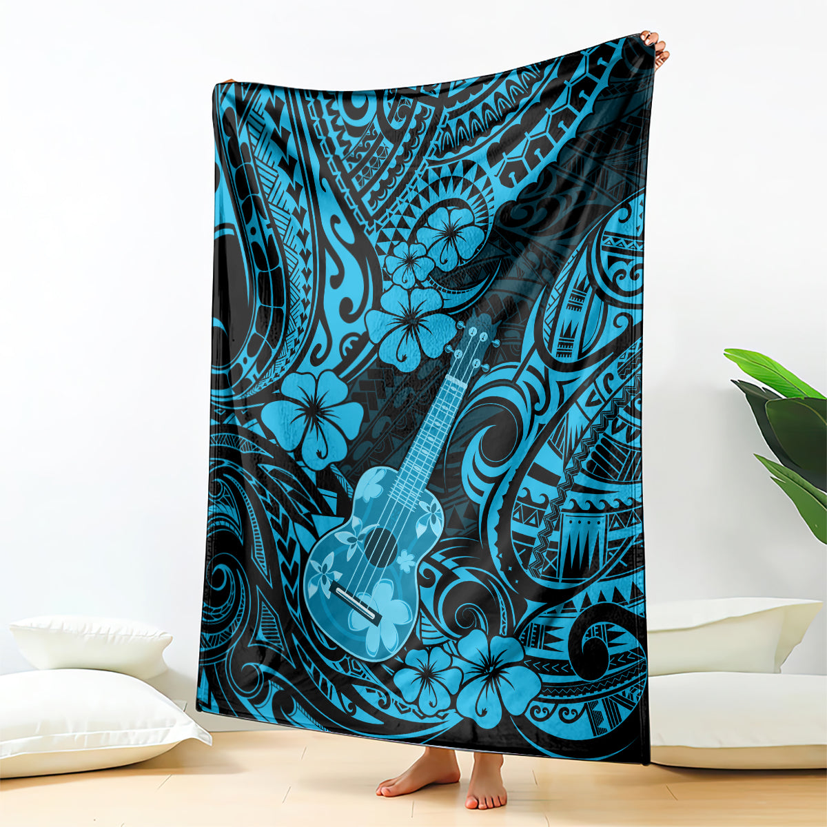 Hawaiian ukulele blanket in sky blue with dark tribal swirl and flower-and-guitar pattern