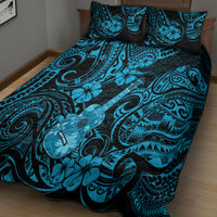 Blue and black quilt bed set with swirling floral polynesian pattern and two pillows
