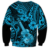 Unisex sweatshirt with blue Hawaiian ukulele and hibiscus pattern, black cuffs and hem