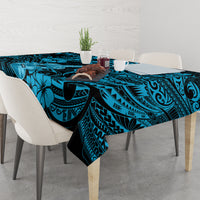 Blue Polynesian tablecloth on dining table with tiki scallops and floral motifs