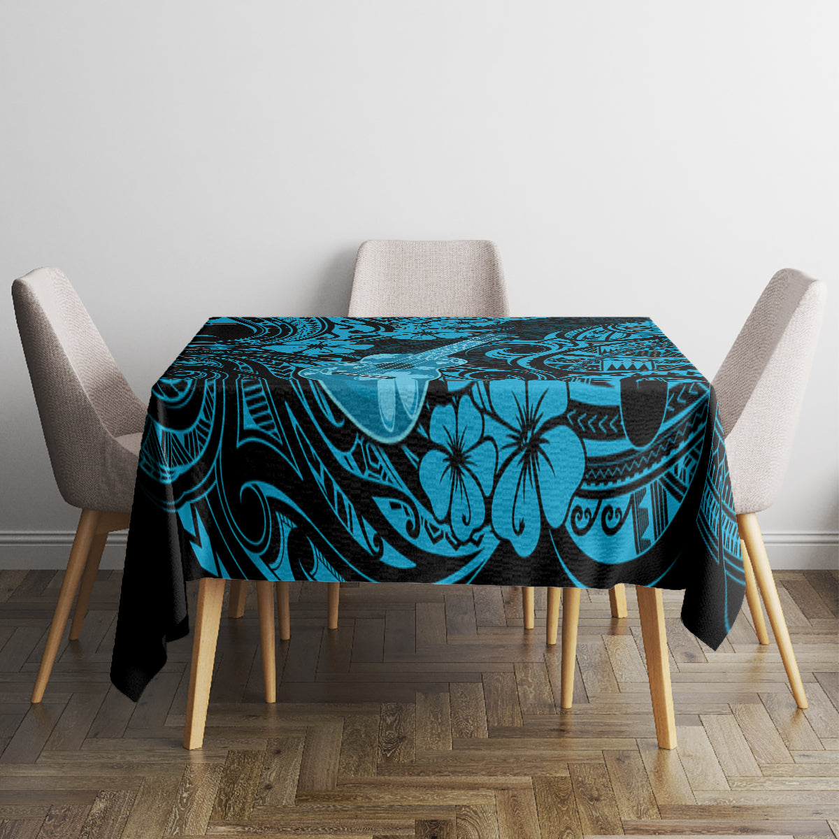 Blue Polynesian tablecloth with tiki swirls and hibiscus flowers on dining table