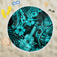 Turquoise round beach blanket with tassel fringe and Polynesian ukulele pattern
