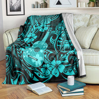 Turquoise Polynesian ukulele blanket draped over seating with hibiscus and guitar icons