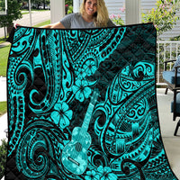 Turquoise Polynesian pattern quilt with black border, guitar and floral swirl designs