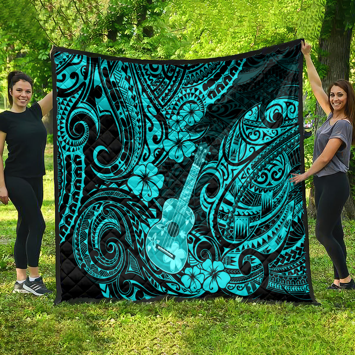 Turquoise and black Polynesian pattern quilt featuring ukulele, waves, and hibiscus