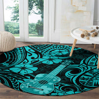 Turquoise Polynesian round rug with large guitar graphic and tribal swirls