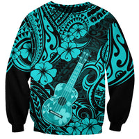 Turquoise crewneck sweatshirt with black sleeves, hibiscus & ukulele print
