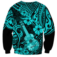 Turquoise crewneck sweatshirt with black sleeves, ukulele and tribal swirl print