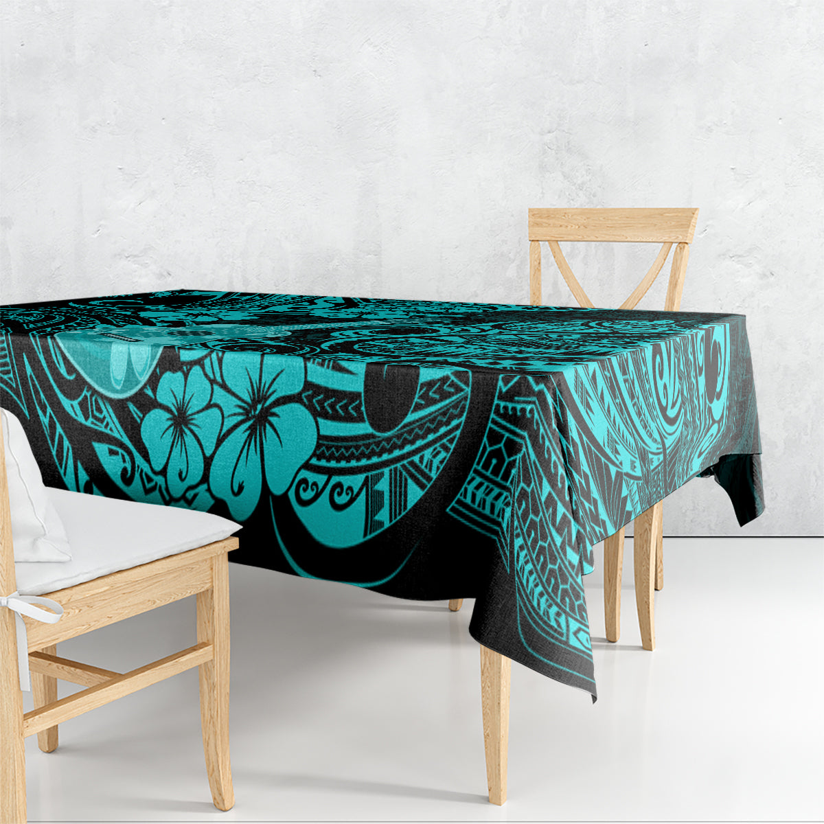 Turquoise tablecloth draped over rectangular table with black ocean-style motifs