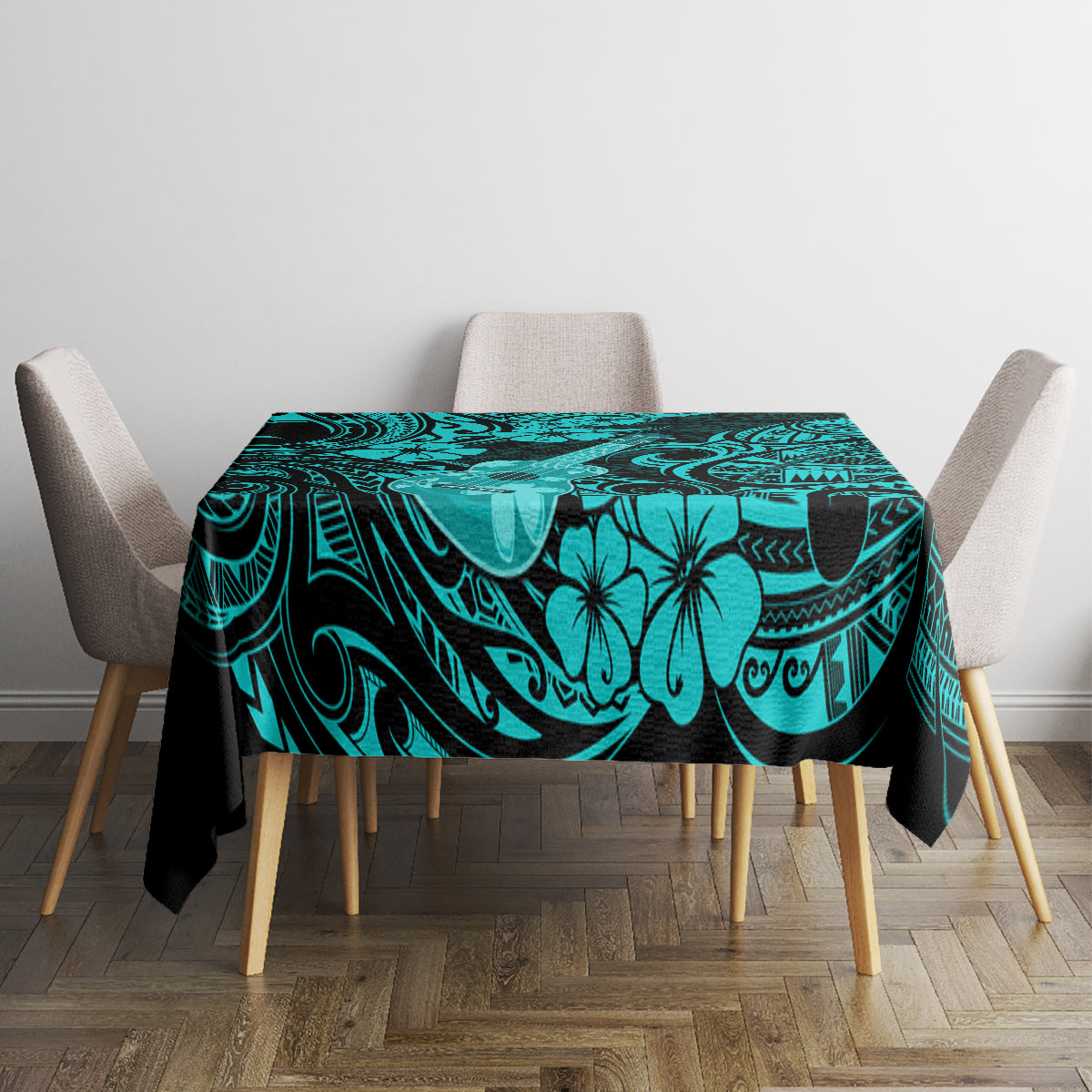 Turquoise tablecloth covering dining table with black floral and swirl pattern