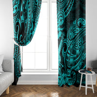Turquoise Polynesian-pattern window curtain pair framing a white door