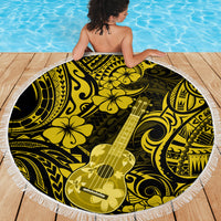 Round yellow beach blanket with fringed border and bold black ukulele floral pattern