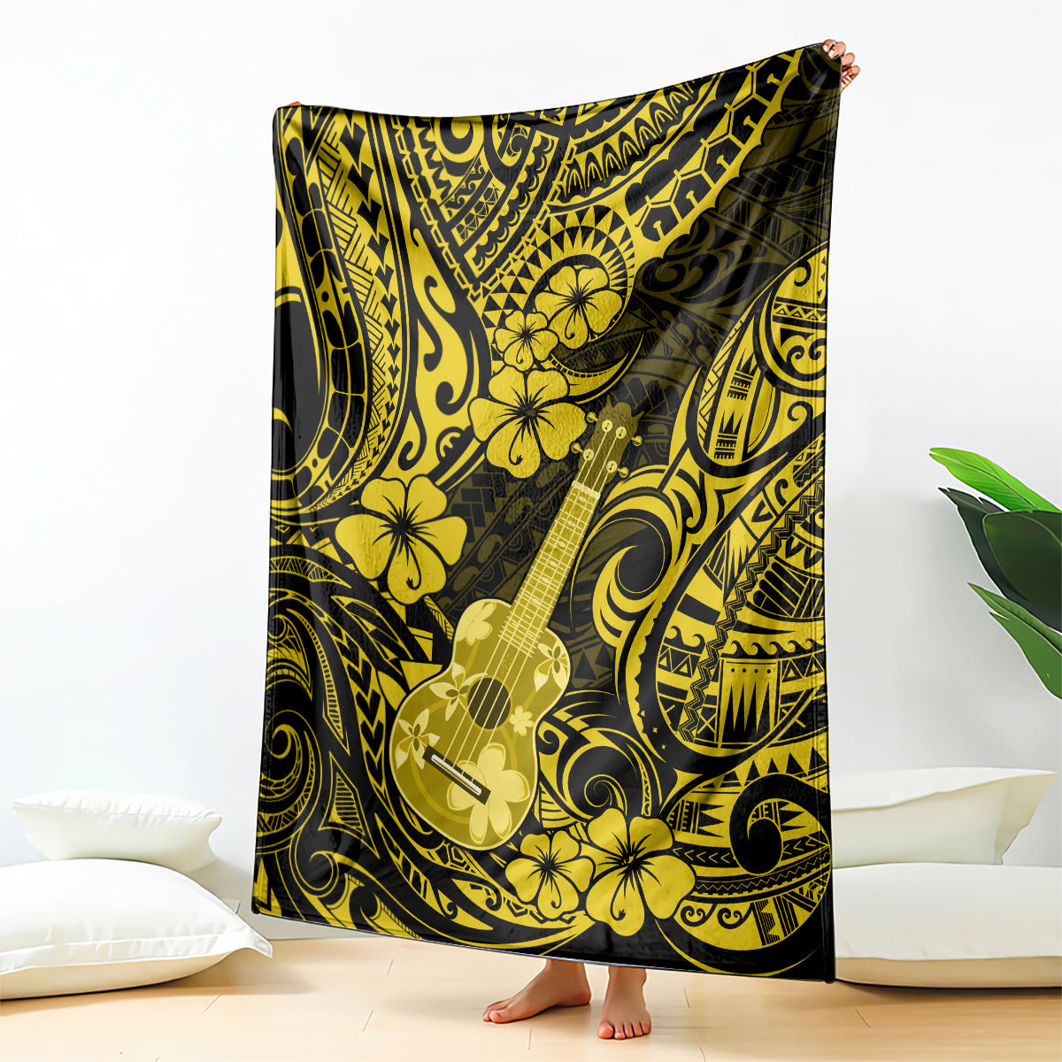 Yellow and black Polynesian ukulele blanket with hibiscus flowers, draped over surface