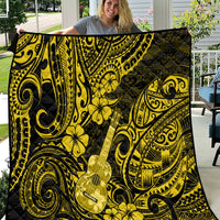 Yellow and black polynesian quilt blanket with ukulele, swirls, and flower motifs