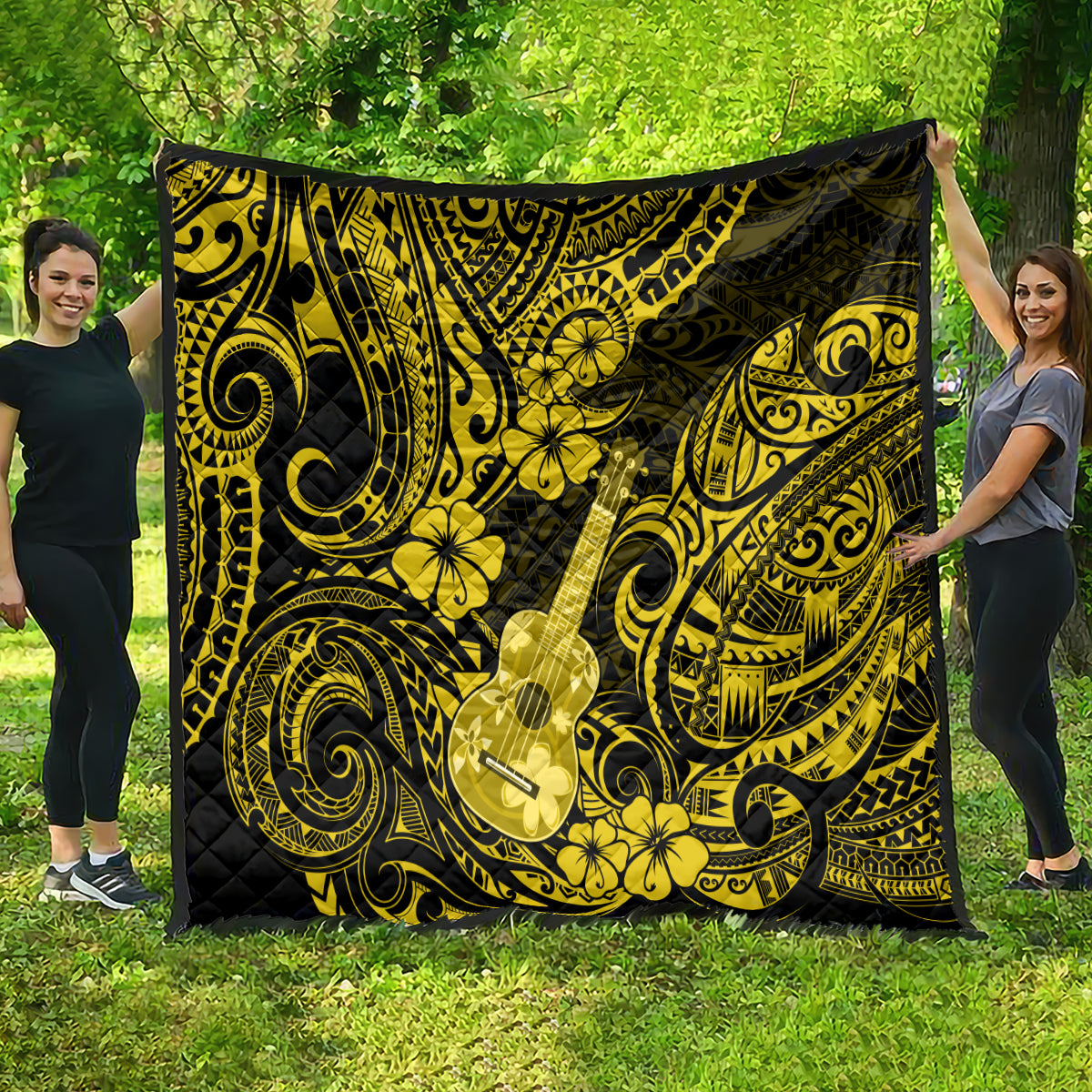 Yellow and black polynesian quilt blanket featuring a ukulele and ornate scroll pattern