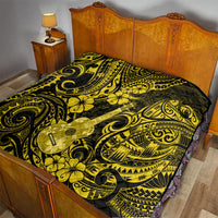 Yellow and black polynesian quilt blanket with ukulele and floral scroll pattern on bed